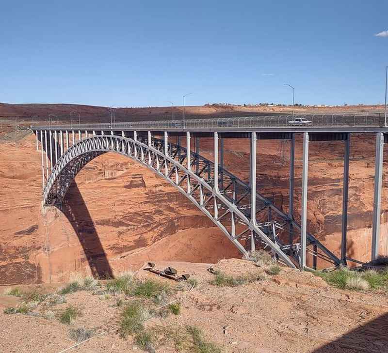 a bridge over a canyon in the desert