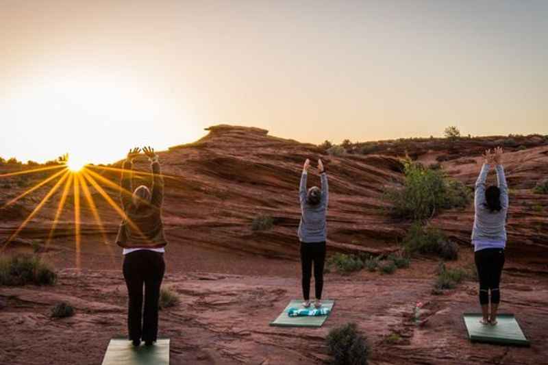people that do yoga in the desert
