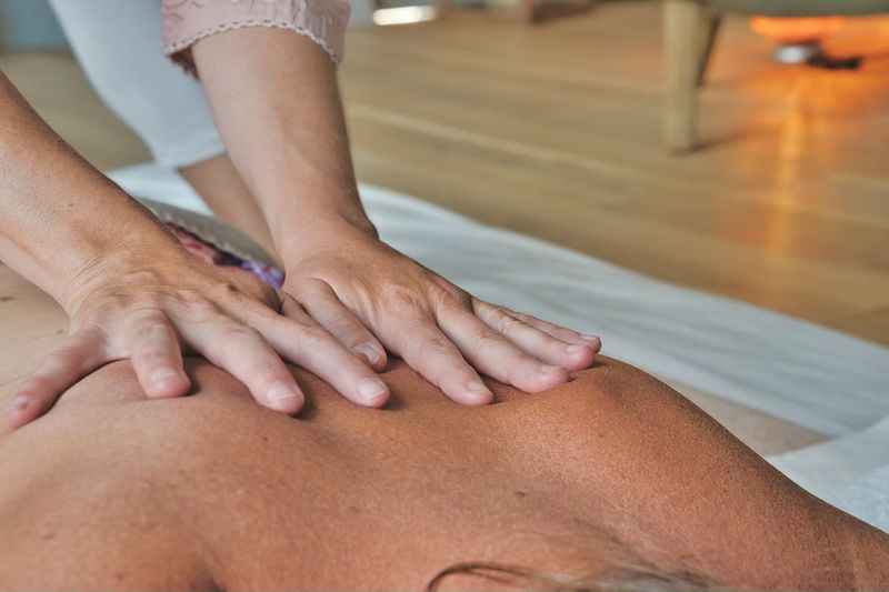 a woman getting a massage at the spa