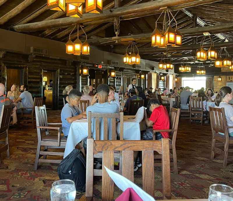 a restaurant with people sitting at tables and eating