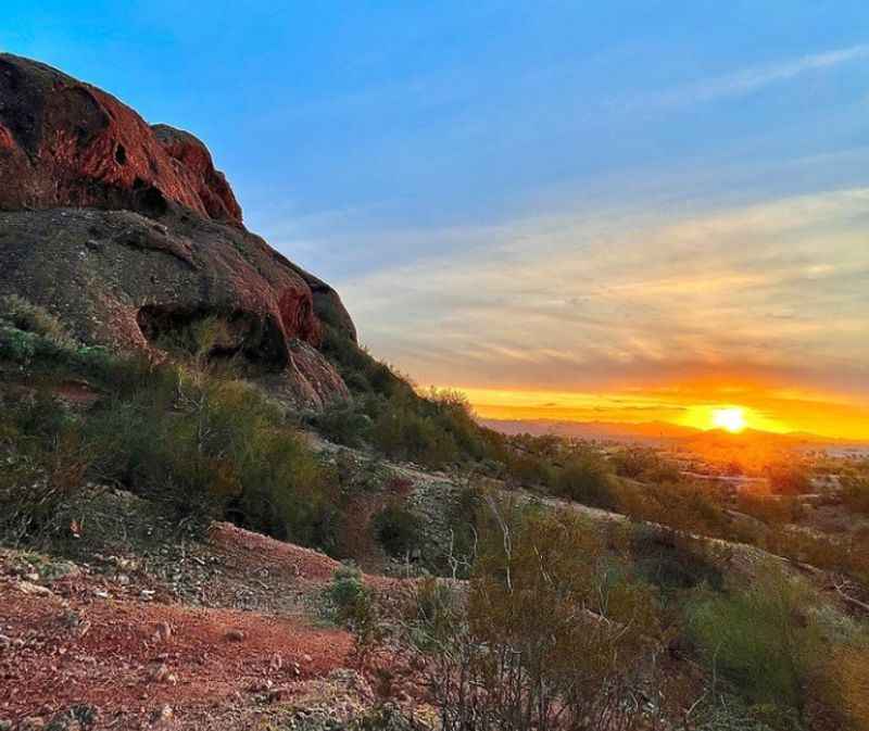 a sunset view from the top of a mountain