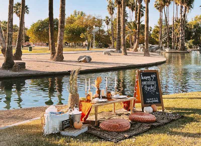 a picnic table beside the man-made river