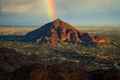 breathtaking view of mountain with rainbow over it