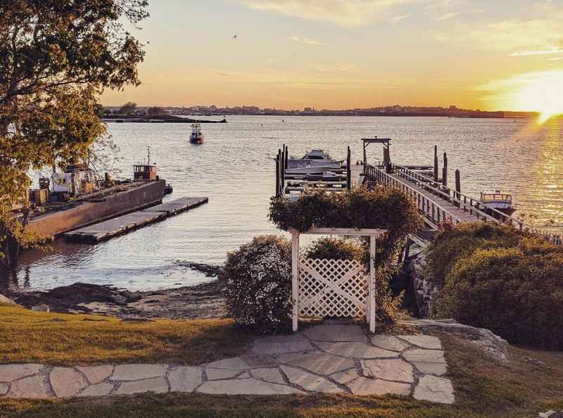 a dock with a boat docked at sunset