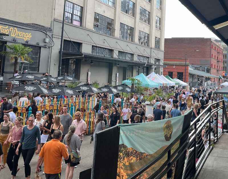 a crowd of people walking down a street