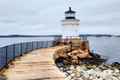 a lighthouse on the shore of a body of water