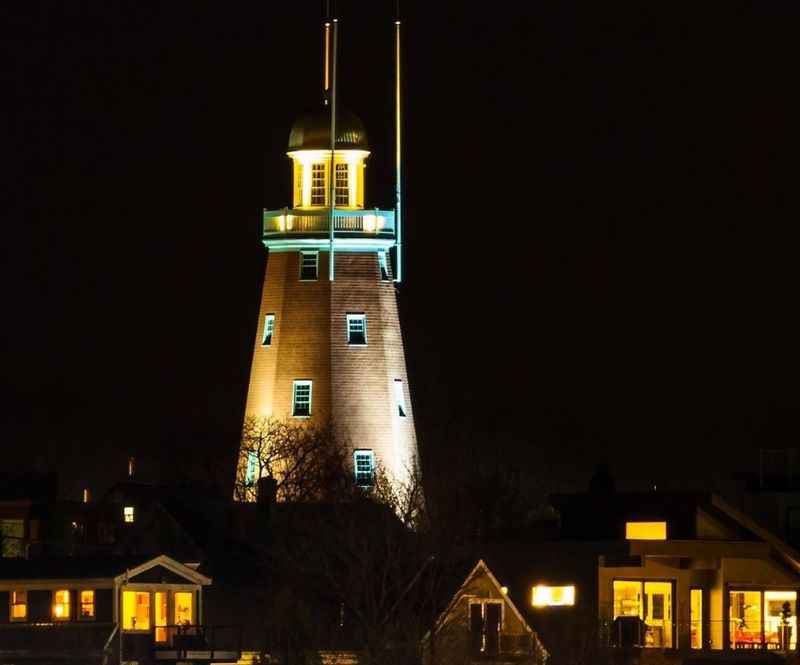 a lighthouse at night with a light on it