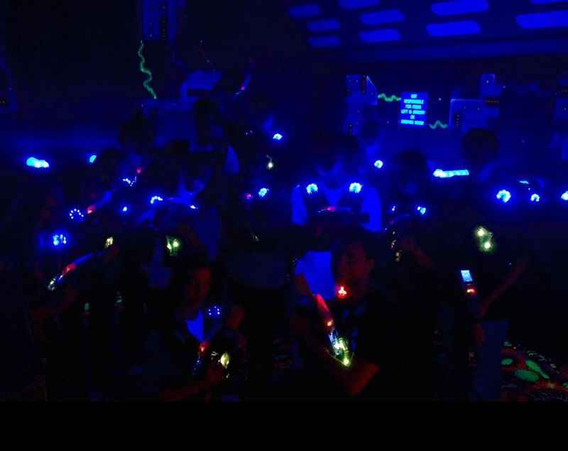a party with blue and green lights