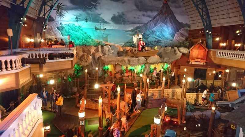 a large indoor play area with a large model of a cave