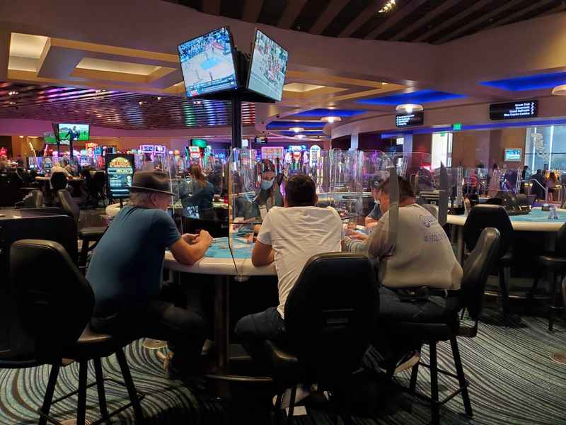 people playing poker at the casino