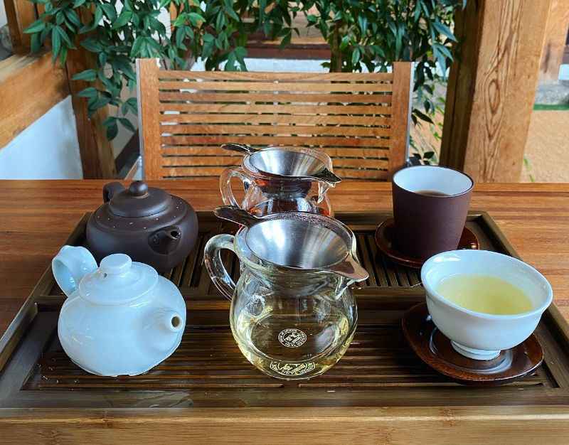 a wooden tray holding a tea set