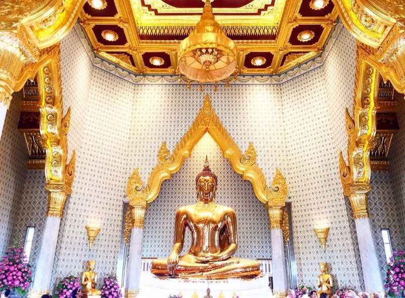 the golden buddha statue inside the temple