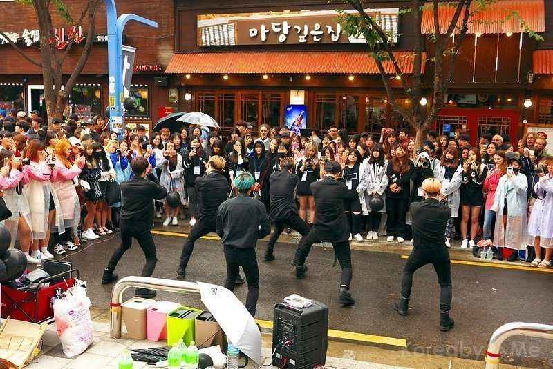 a group of people perform dances on the street