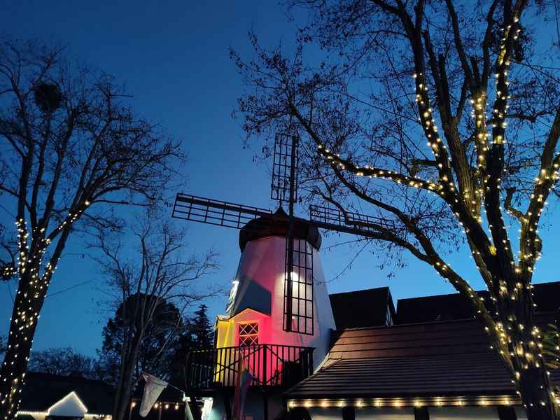 a windmill with lights on it