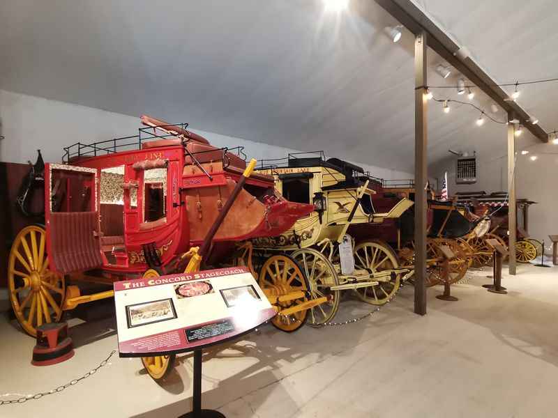 a red and yellow horse drawn carriage