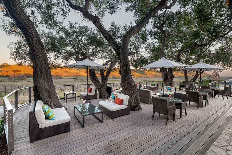 a wooden deck with view of the hills