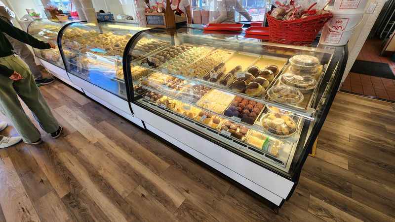 a display case filled with pastries and pastries