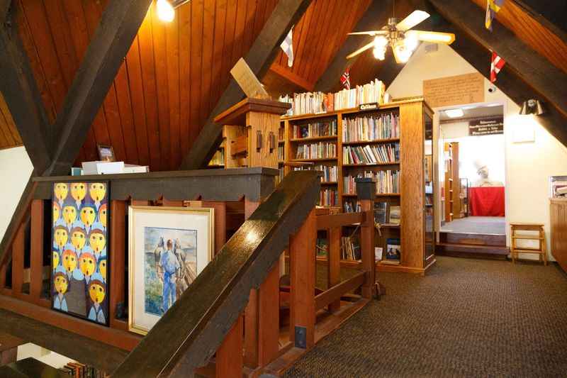 a room with a book shelf and a book shelf