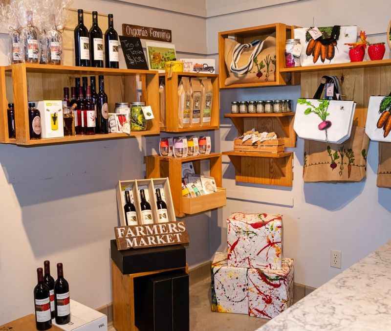 kitchen with a counter and shelves filled with wine bottles