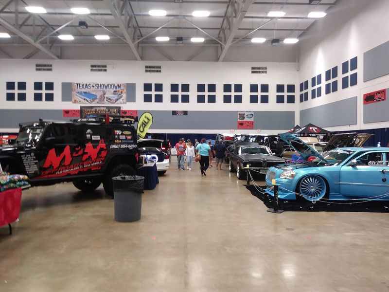 a large room filled with lots of cars