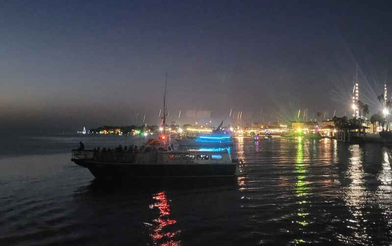 a boat is in the water at night