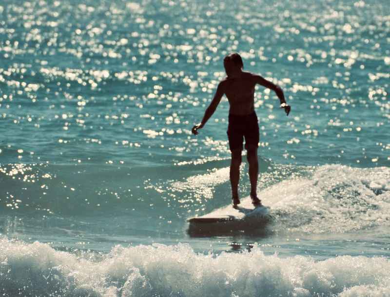 a person riding a surf board on a wave