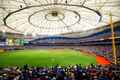 a baseball stadium filled with fans and a large dome