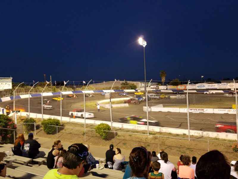 a crowd of people watching a car race