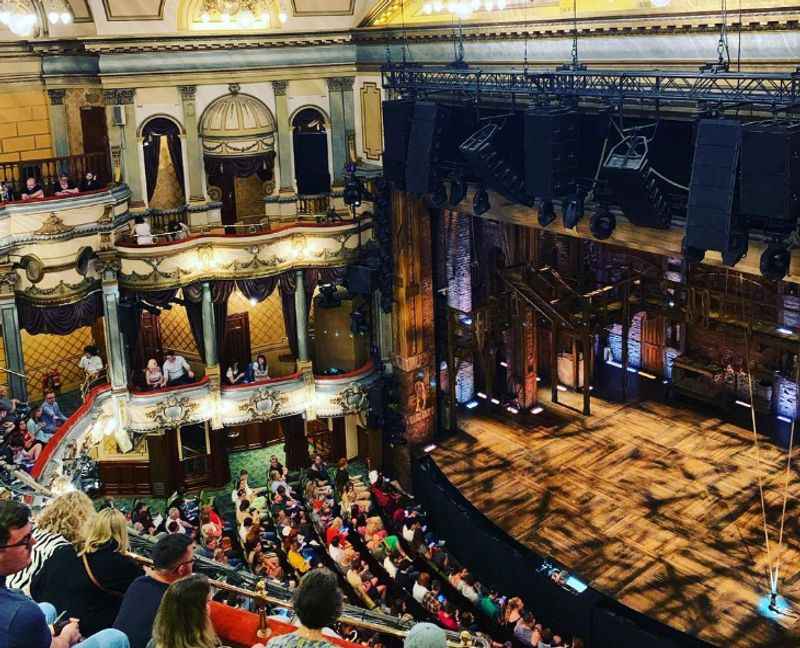 the stage at the theatre with people watching