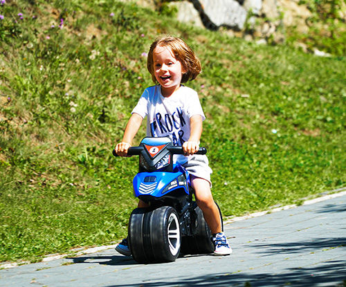 Porteur jouet en forme de moto bleu et noir