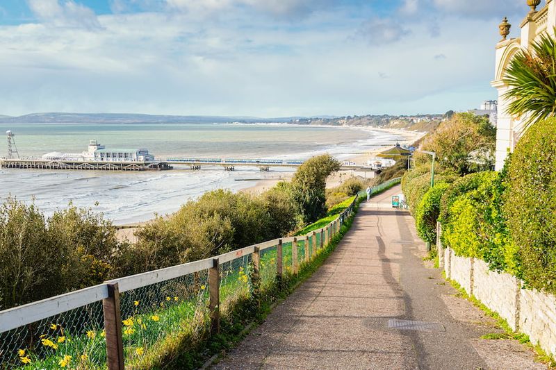 The clifftop path above Bournemouth beach looking towards the pier