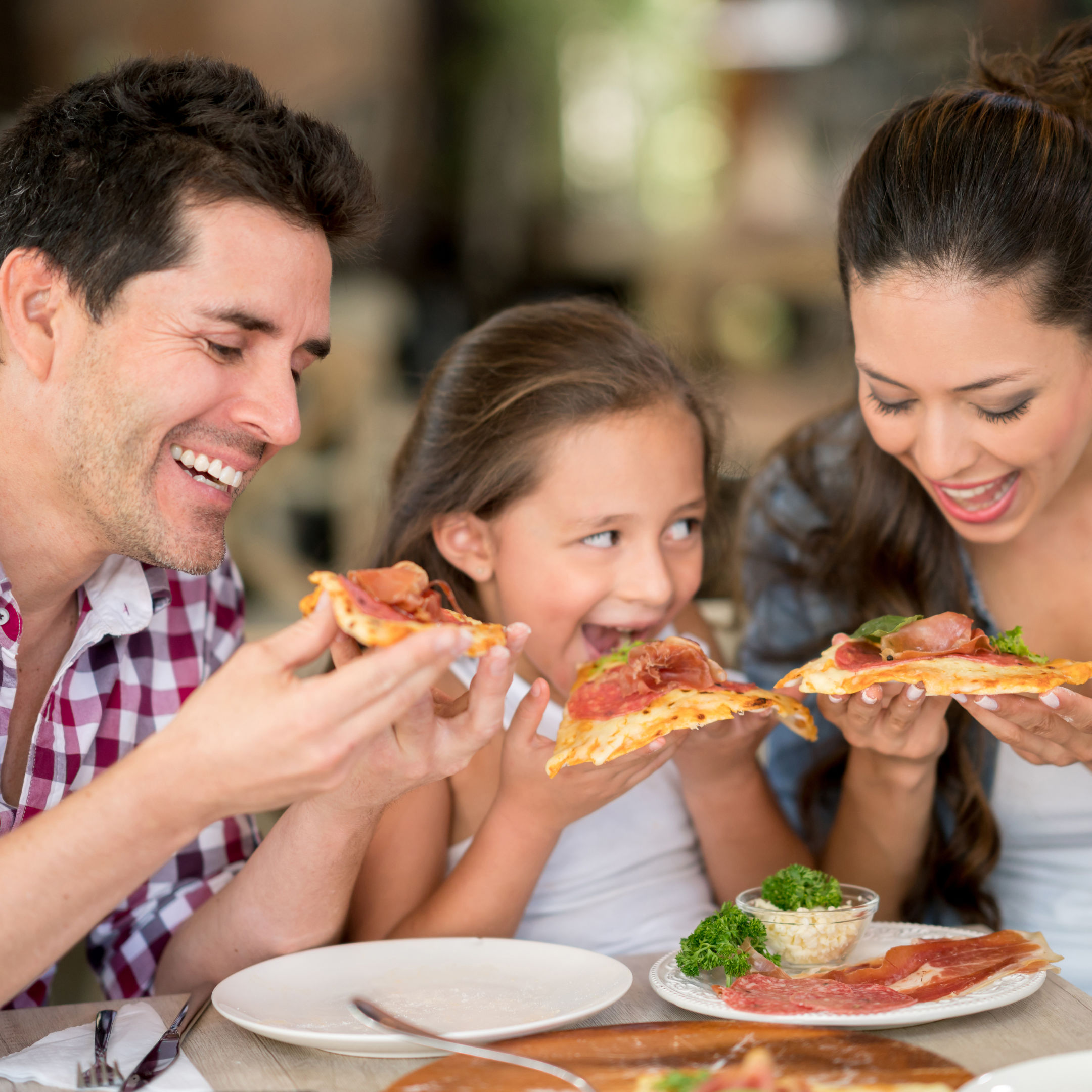 Family enjoying a pizza meal together