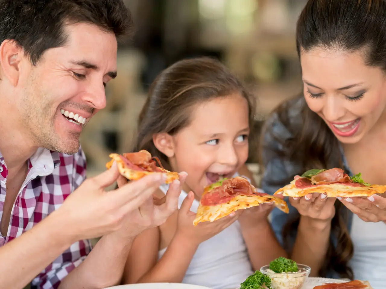 Family enjoying a pizza meal together