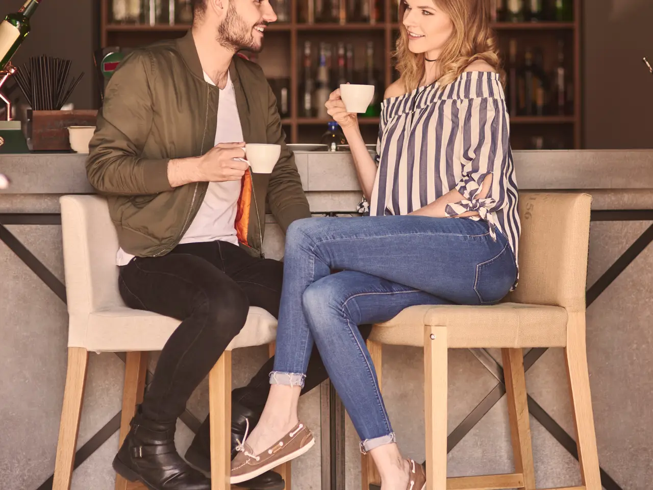 Couple enjoying drinks at a bar