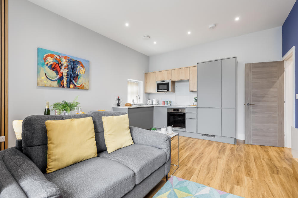 The open-plan living room of an apartment at Coast Apartments Hotel, Bournemouth