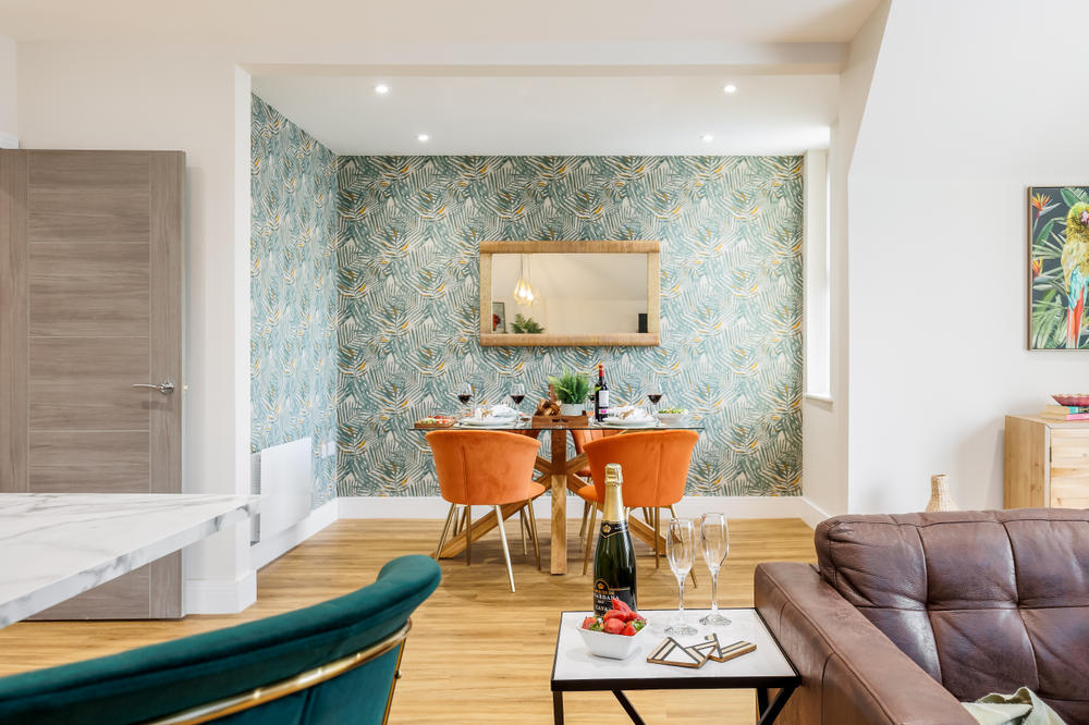 A family room with a dining area at Pebbles Apartments Hotel, Bournemouth