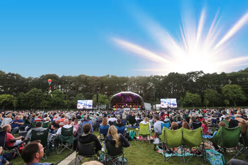 Festival crowds in the sunshine in a Bournemouth park