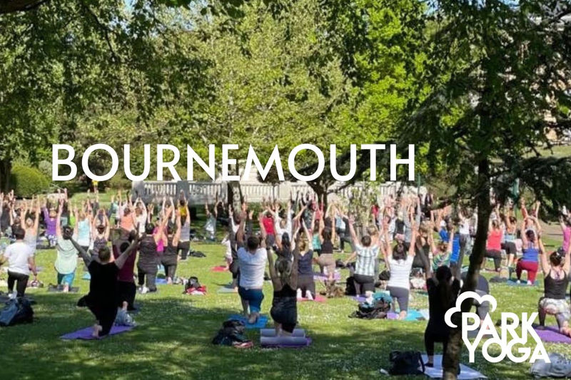 A group yoga session in a Bournemouth park