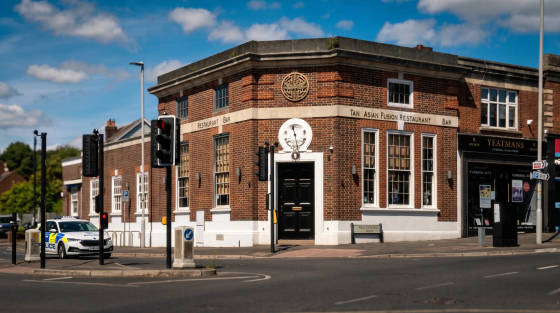 Corner view of Tan Asian Fusion Restaurant and Yeatmans funeral directors