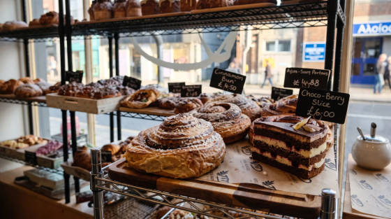 Cinnamon bun, Choco-Berry slice and pastries on display