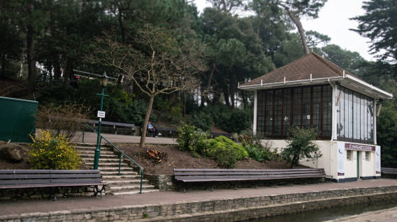 St Margaret's Station building with benches and trees nearby