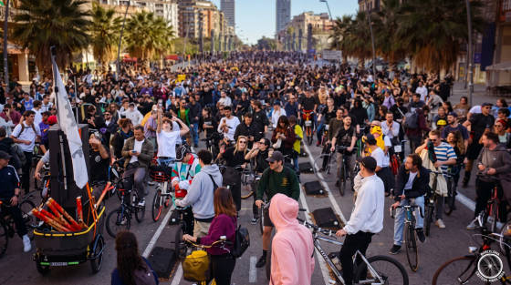 Large group of cyclists gathered on a city street