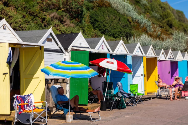 A family outside a beach hut in Bournemouth