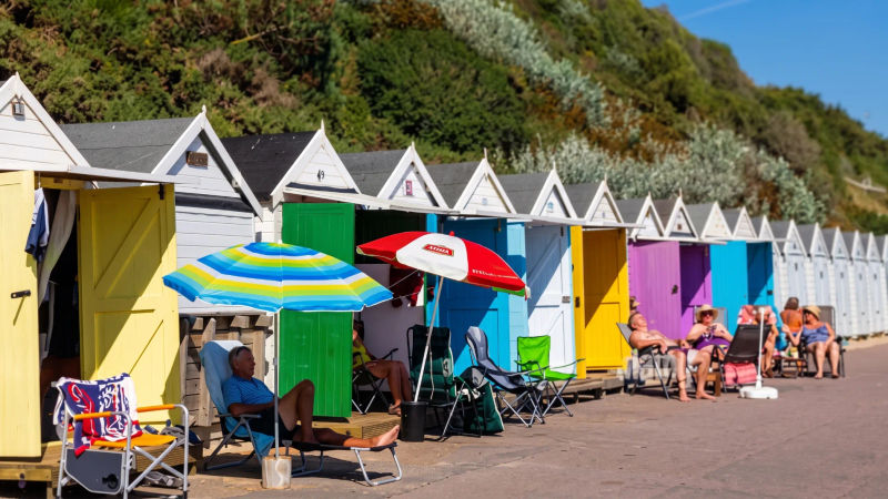 A family outside a beach hut in Bournemouth