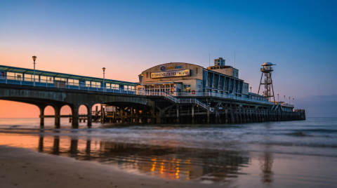 Bournemouth Pier Theatre with reflections in the water