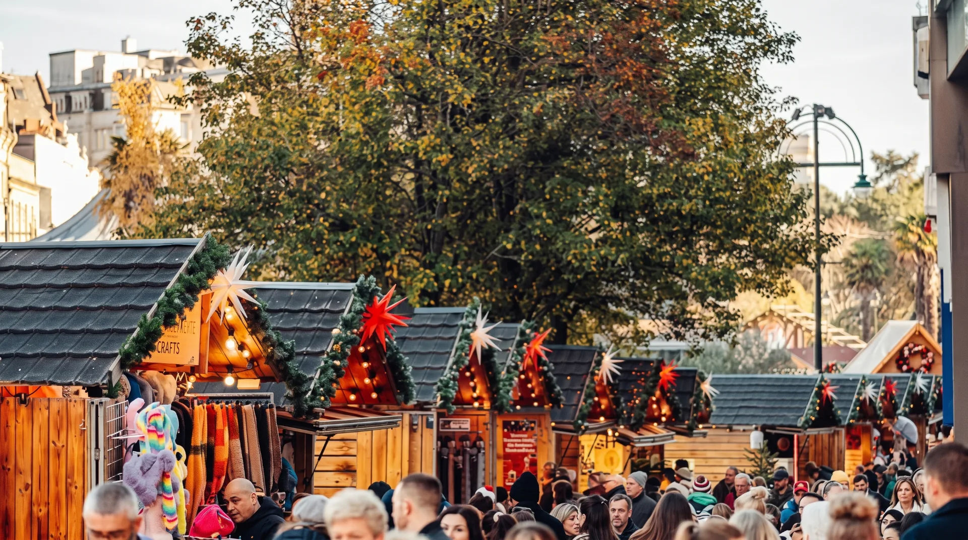 Festive market stalls adorned with lights and decorations, bustling with visitors in Bournemouth