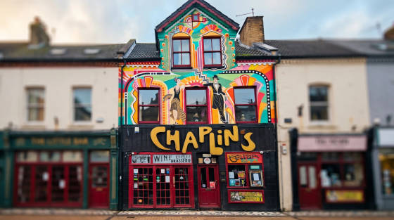 Colourful mural and signage of Chaplin's bar in Bournemouth