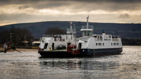 Two Bembridge ferries with cars on board approaching a landing stage