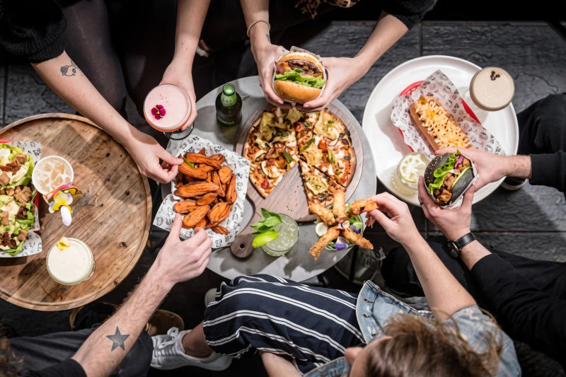 Plates being shared at a restaurant table in Bournemouth