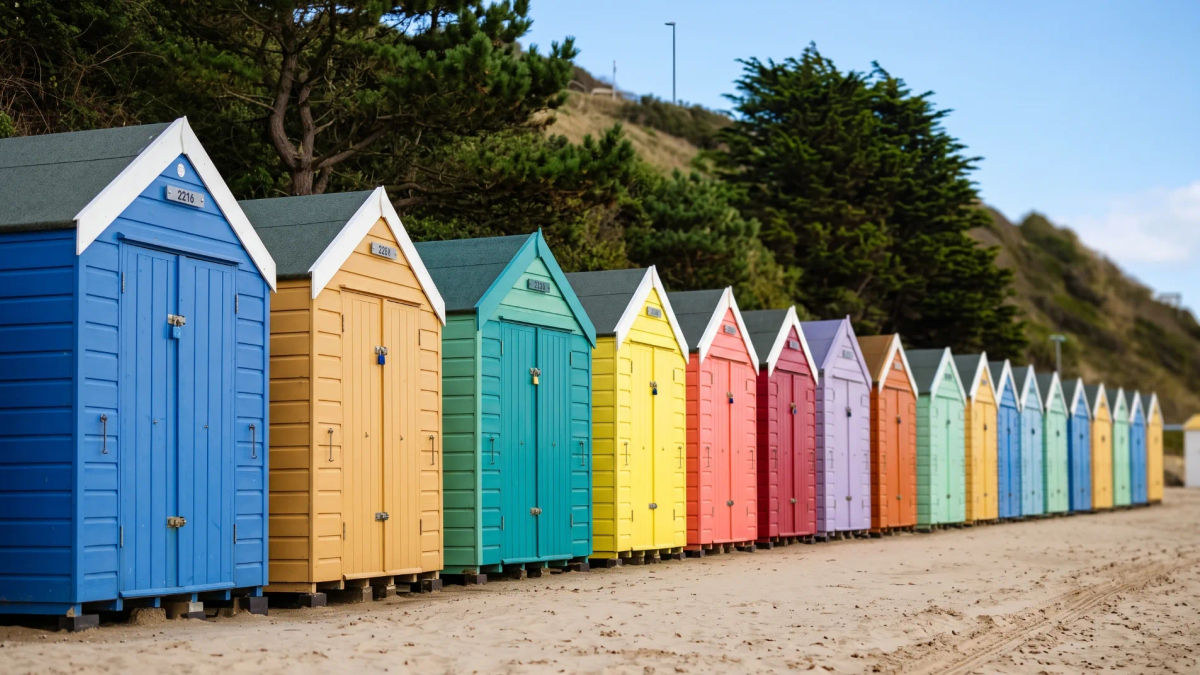 Colourful beach huts under the pines on the Bournemouth seafront